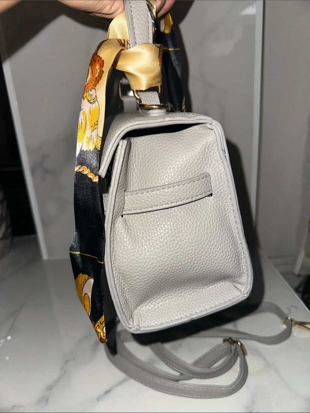 Stylish Gray Leather Crossbody Bag with Scarf Accent